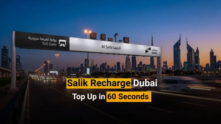 Expat driver doing a Salik recharge on his phone in a car on Sheikh Zayed Road, Dubai